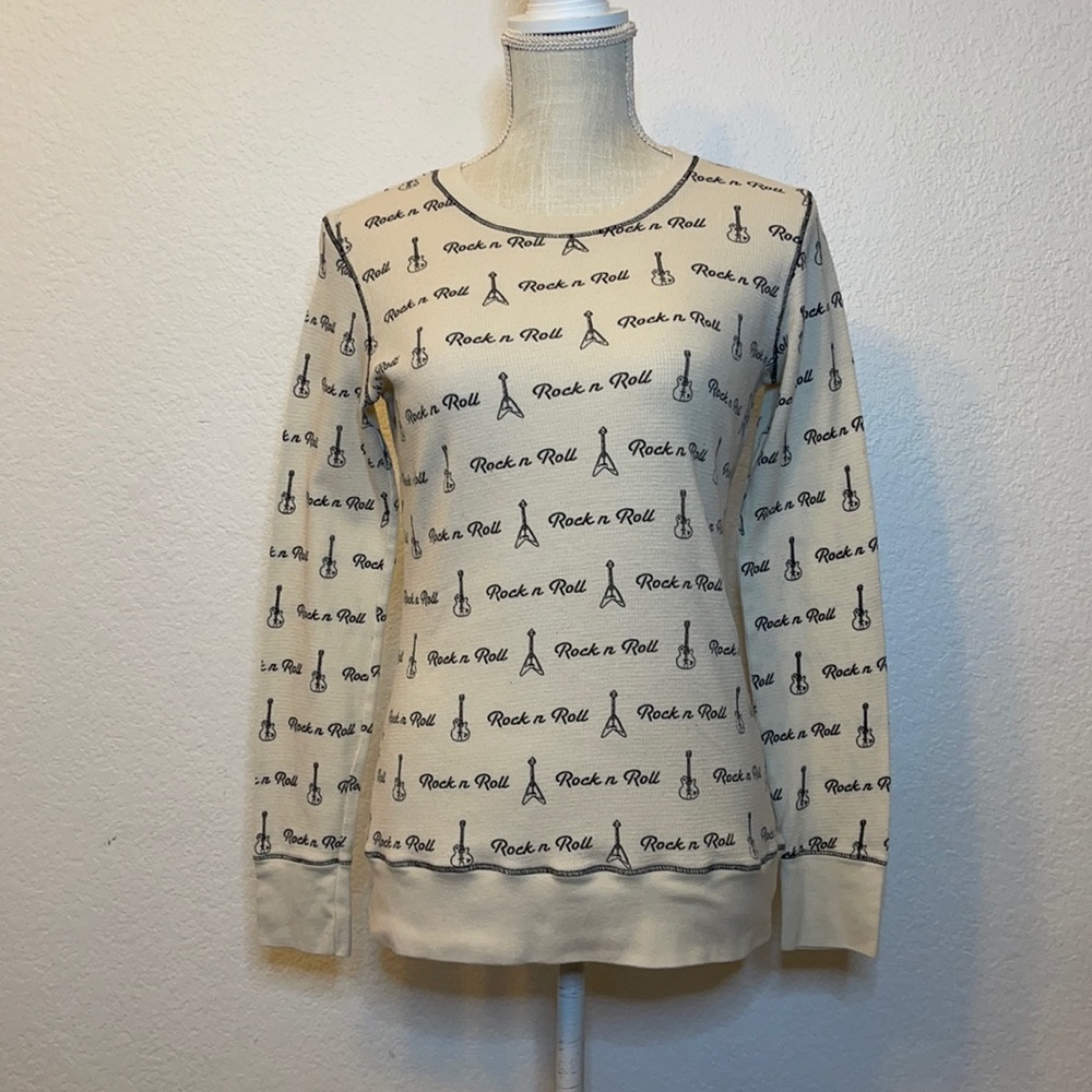 Woman’s Forever 21 size L long sleeve cream thermal shirt. Rock N Roll print.